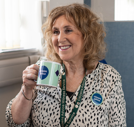 volunteering woman drinking from mug